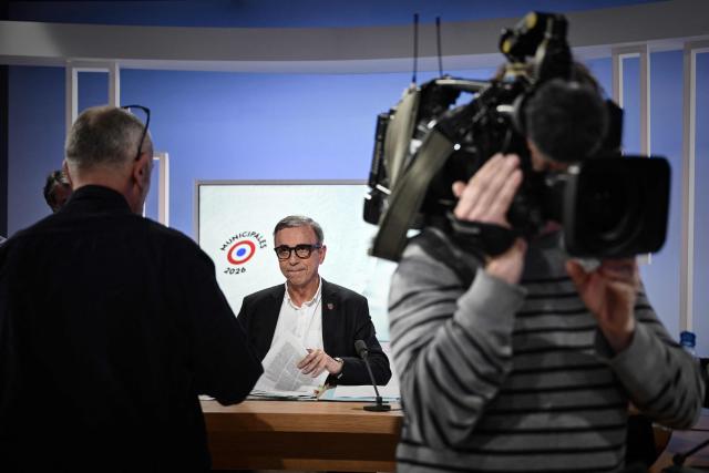 Bordeaux incumbent mayor Pierre Hurmic reviews his notes on the set of France 3 television in Bordeaux, south-western France, on March 18, 2026, ahead of a televised debate against Renaissance-Horizons challenger Thomas Cazenave before the second round of the 2026 French municipal elections on March 22. (Photo by Philippe LOPEZ / AFP)