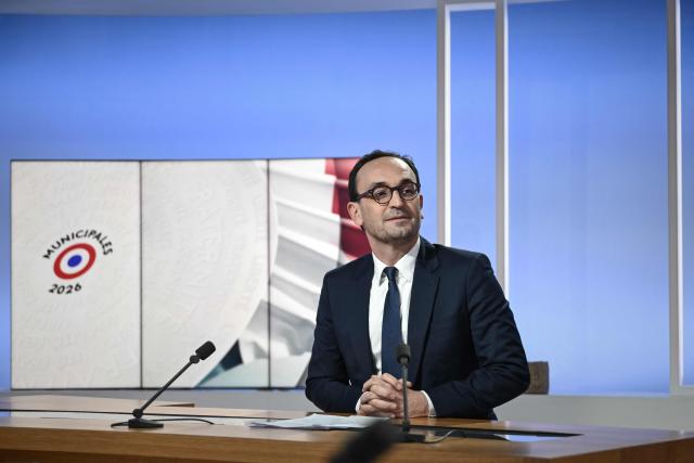 Thomas Cazenave, Renaissance-Horizons candidate for the Bordeaux mayoral election, sits at the debate desk on the set of France 3 television in Bordeaux, south-western France, on March 18, 2026, ahead of a televised debate against incumbent mayor Pierre Hurmic before the second round of the 2026 French municipal elections on March 22. (Photo by Philippe LOPEZ / AFP)
