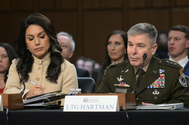 (L/R) US Director of National Intelligence Tulsi Gabbard and Acting Commander of US Cyber Command William Hartman testify during a Senate Committee on Intelligence hearing to examine worldwide threats, on Capitol Hill in Washington, DC, on March 18, 2026. (Photo by Oliver Contreras / AFP)