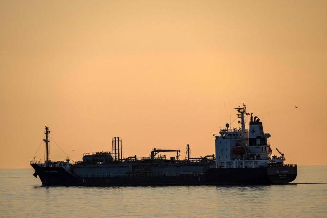This photograph taken from Port de Bouc shows the PGC Taormina oil and petrol tanker anchored in the Grand Port Maritime de Marseille-Fos in Fos-sur-Mer, off the Mediterranean coast of southern France on March 17, 2026. (Photo by MIGUEL MEDINA / AFP)