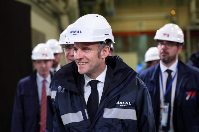 French President Emmanuel Macron visits the construction site of Naval Group Nantes-Indret, where the next generation French aircraft carrier is under construction, near Nantes, western France, on March 18, 2026. (Photo by Gonzalo Fuentes / POOL / AFP)