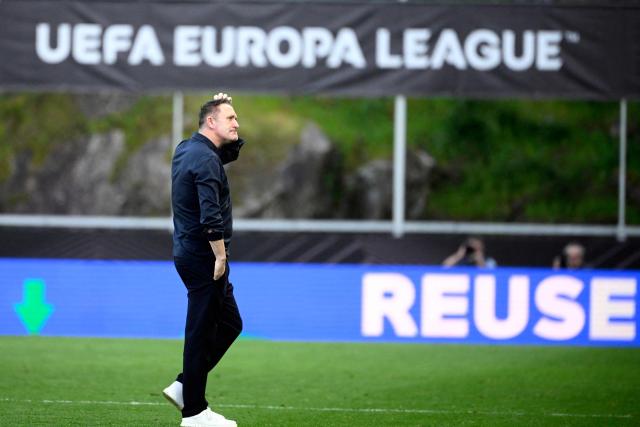 Ferencvaros' Irish coach Robbie Keane reacts at the end of the UEFA Europa League last 16 second leg football match between SC Braga and Ferencvaros at Municipal stadium of Braga on March 18, 2026. (Photo by Miguel RIOPA / AFP)