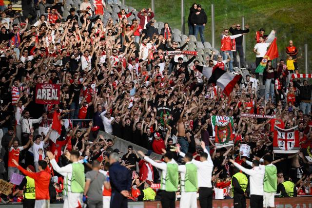 Braga fans celebrate their team's victory at the end of the UEFA Europa League last 16 second leg football match between SC Braga and Ferencvaros at Municipal stadium of Braga on March 18, 2026. (Photo by Miguel RIOPA / AFP)