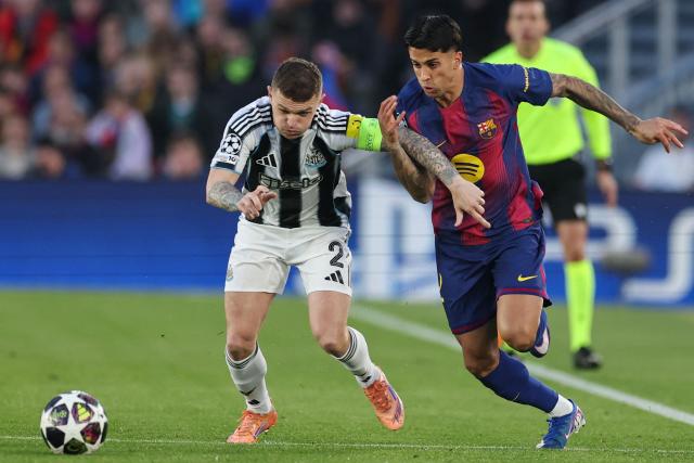 Barcelona's Portuguese defender #02 Joao Cancelo (R) vies for the ball with Newcastle United's English defender #02 Kieran Trippier during the UEFA Champions League last 16 second leg football match between FC Barcelona and Newcastle United at the Camp Nou stadium in Barcelona, on March 18, 2026. (Photo by Josep LAGO / AFP)