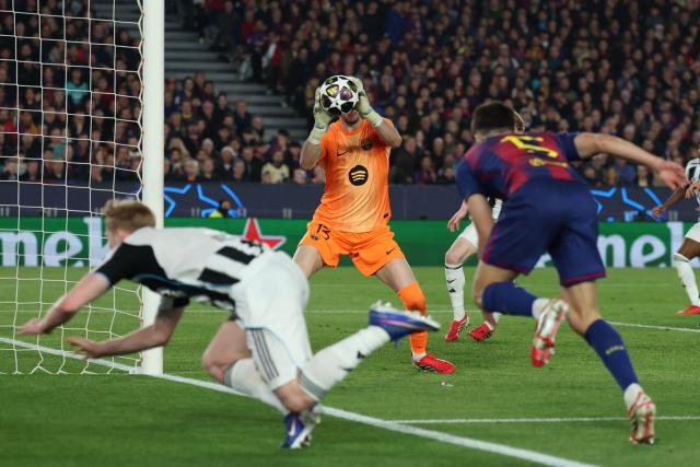 Barcelona's Spanish goalkeeper #13 Joan Garcia makes a save during the UEFA Champions League last 16 second leg football match between FC Barcelona and Newcastle United at the Camp Nou stadium in Barcelona, on March 18, 2026. (Photo by Lluis GENE / AFP)