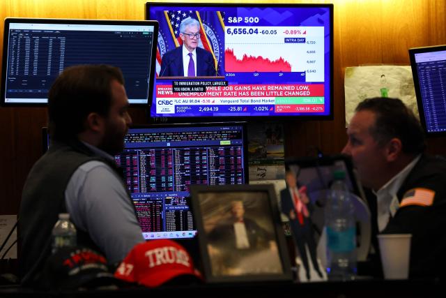 A livestream shows Jerome Powell, chairman of the US Federal Reserve, speaking after a Federal Open Market Committee (FOMC) meeting on the floor of the New York Stock Exchange (NYSE) in New York on March 18, 2026. The US Federal Reserve kept interest rates unchanged Wednesday as expected, in defiance of President Donald Trump as the world's largest economy battles stubborn inflation, weak labor demand and an "uncertain" economic outlook due to the war in Iran. The Fed's 11-1 vote kept rates steady at a range between 3.50 percent and 3.75 percent, with officials flagging one expected rate cut by the end of the year. (Photo by ANGELA WEISS / AFP)