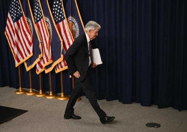 US Federal Reserve Chair Jerome Powell departs after holding a press conference following the Federal Open Market Committee meeting at the Federal Reserve Board Building in Washington, DC, on March 18, 2026. The US Federal Reserve kept interest rates unchanged Wednesday as expected, in defiance of President Donald Trump as the world's largest economy battles stubborn inflation, weak labor demand and an "uncertain" economic outlook due to the war in Iran. The Fed's 11-1 vote kept rates steady at a range between 3.50 percent and 3.75 percent, with officials flagging one expected rate cut by the end of the year. (Photo by Brendan SMIALOWSKI / AFP)