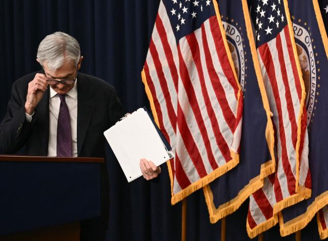 US Federal Reserve Chair Jerome Powell departs after holding a press conference following the Federal Open Market Committee meeting at the Federal Reserve Board Building in Washington, DC, on March 18, 2026. The US Federal Reserve kept interest rates unchanged Wednesday as expected, in defiance of President Donald Trump as the world's largest economy battles stubborn inflation, weak labor demand and an "uncertain" economic outlook due to the war in Iran. The Fed's 11-1 vote kept rates steady at a range between 3.50 percent and 3.75 percent, with officials flagging one expected rate cut by the end of the year. (Photo by Brendan SMIALOWSKI / AFP)