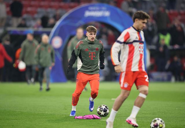 Bayern Munich's German midfielder #42 Lennart Karl warms up prior to the UEFA Champions League, Round of 16 2nd-leg football match between FC Bayern Munich and Atalanta in Munich, southern Germany, on March 18, 2026. (Photo by Alexandra BEIER / AFP)