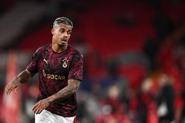 Galatasaray's Gabonese midfielder #99 Mario Lemina warms up ahead of the UEFA Champions League, round of 16 second leg football match between Liverpool and Galatasaray at Anfield in Liverpool, north-west England on March 18, 2026. (Photo by Paul ELLIS / AFP)