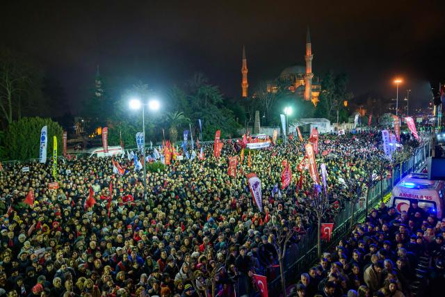 Supporters gather during a protest marking one year since the detention of Istanbul Mayor Ekrem Imamoglu at Sarachane Square in Istanbul on March 18, 2026. Thousands of people gathered outside Istanbul City Hall March 18, 2026 to mark one year since the arrest of the city's mayor, Ekrem Imamoglu in a graft probe widely seen as a politically motivated act against the key opponent of President Recep Tayyip Erdogan. (Photo by Yasin AKGUL / AFP)