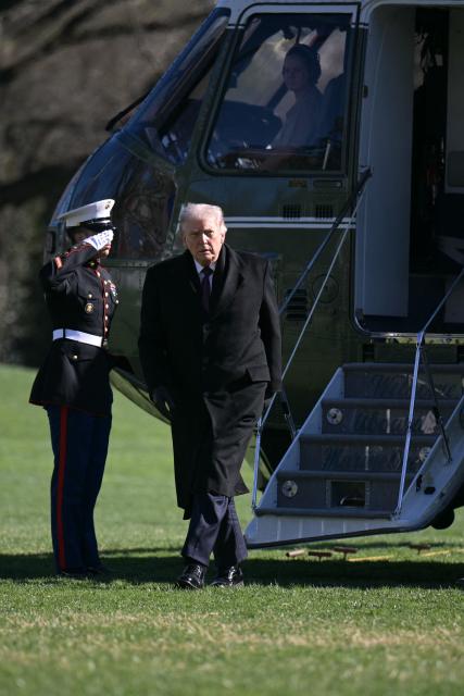 US President Donald Trump walks to the Oval Office at the White House in Washington, DC, as he returns from Dover Air Force Base in Delaware after attending a dignified transfer solemn event on March 18, 2026. President Trump traveled to Dover Air Force Base to pay his respects to 6 US military members who were killed during a crash of a refueling aircraft in western Iraq last week. (Photo by Oliver Contreras / AFP)