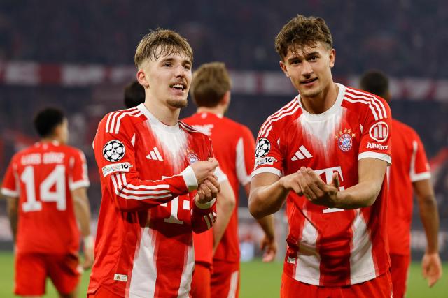 Bayern Munich's German midfielder #42 Lennart Karl celebrates scoring the 3-0 goal with his teammates including Bayern Munich's German midfielder #20 Tom Bischof (R) during the UEFA Champions League, Round of 16 2nd-leg football match between FC Bayern Munich and Atalanta in Munich, southern Germany, on March 18, 2026. (Photo by Alexandra BEIER / AFP)