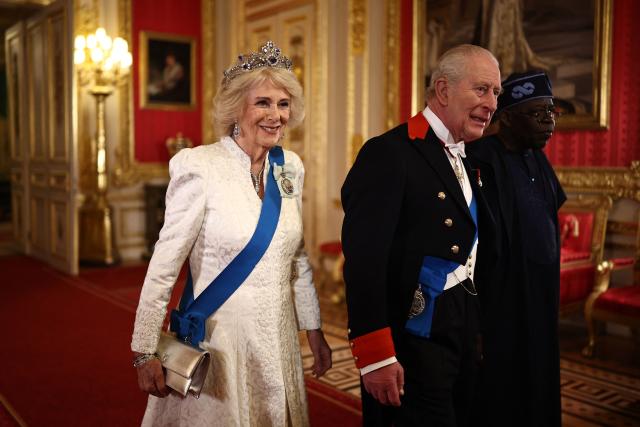 Britain's Queen Camilla, Britain's King Charles III and Nigeria's President Bola Tinubu arrive to attend a State Banquet in St George's Hall, at Windsor Castle, in Windsor, on March 18, 2026, on the first day of a two-day State Visit to the United Kingdom by Nigeria's President. (Photo by Henry Nicholls / POOL / AFP)