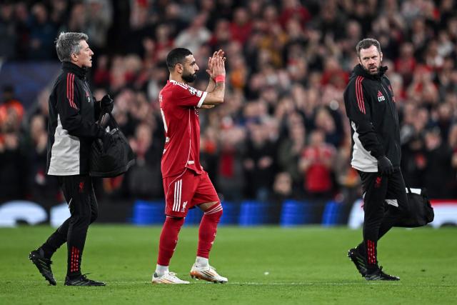 Liverpool's Egyptian forward #11 Mohamed Salah applauds as he leaves the pitch after being substituted during the UEFA Champions League, round of 16 second leg football match between Liverpool and Galatasaray at Anfield in Liverpool, north-west England on March 18, 2026. (Photo by Paul ELLIS / AFP)