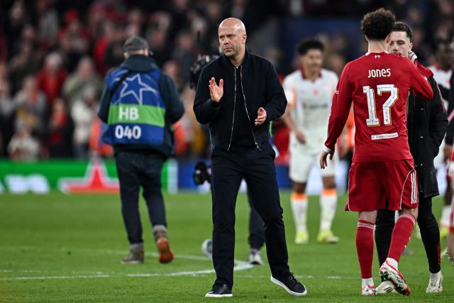 Liverpool's Dutch coach Arne Slot applauds following the victory at the end of the UEFA Champions League, round of 16 second leg football match between Liverpool and Galatasaray at Anfield in Liverpool, north-west England on March 18, 2026. (Photo by Paul ELLIS / AFP)
