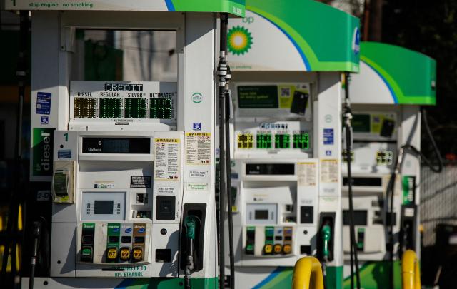 Gas prices are seen at a gas station in Linden, New Jersey, on March 18, 2026. Oil prices surged Wednesday following a strike on a major Iranian gas facility as the Federal Reserve raised its inflation forecast while holding interest rates steady. (Photo by kena betancur / AFP)