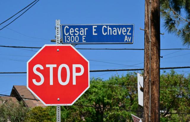 A street sign bearing the name of labor leader and civil rights activist Cesar E. Chavez is seen near a stop sign in the Boyle Heights area of Los Angeles on March 18, 2026. US civil rights icon Cesar Chavez, whose decades of campaigning brought profound and lasting changes to workers' rights, was a serial rapist who abused children and harassed women in the movement he led, a bombshell  New York Times investigation said March 18.
Over years in which the charismatic Chavez galvanised farmworkers, winning reforms for a marginalised group and global recognition for himself, he was also molesting youngsters and coercing women into sexual relationships. (Photo by Frederic J. Brown / AFP)
