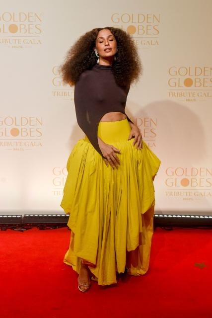 Brazilian actress Camila Pitanga poses for photos on the red carpet during the Golden Globes Tribute Gala at the Copacabana Palace Hotel in Rio de Janeiro, Brazil on March 18, 2026. (Photo by Daniel RAMALHO / AFP)