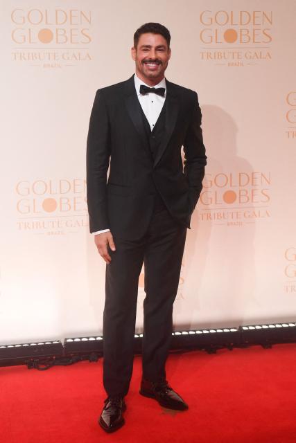 Brazilian actor Caua Raymond poses for photos on the red carpet during the Golden Globes Tribute Gala at the Copacabana Palace Hotel in Rio de Janeiro, Brazil on March 18, 2026. (Photo by Daniel RAMALHO / AFP)