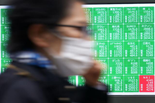 An electronic quotation board displays the Nikkei 225 stock prices on the Tokyo Stock Exchange in Tokyo on March 19, 2026. (Photo by Kazuhiro NOGI / AFP)