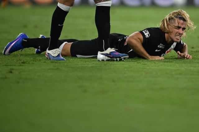 Vasco da Gama's Argentinian forward #77 Claudio Spinelli looks up from the ground after missing a scoring opportunity during the Brasileirao Serie A football match between Vasco da Gama and Fluminense at the Maracana Stadium in Rio de Janeiro, Brazil, on March 18, 2026. (Photo by MAURO PIMENTEL / AFP)