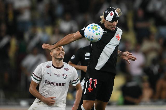 Vasco da Gama's Argentinian forward #77 Claudio Spinelli scores his team's second goal during the Brasileirao Serie A football match between Vasco da Gama and Fluminense at the Maracana Stadium in Rio de Janeiro, Brazil, on March 18, 2026. (Photo by MAURO PIMENTEL / AFP)