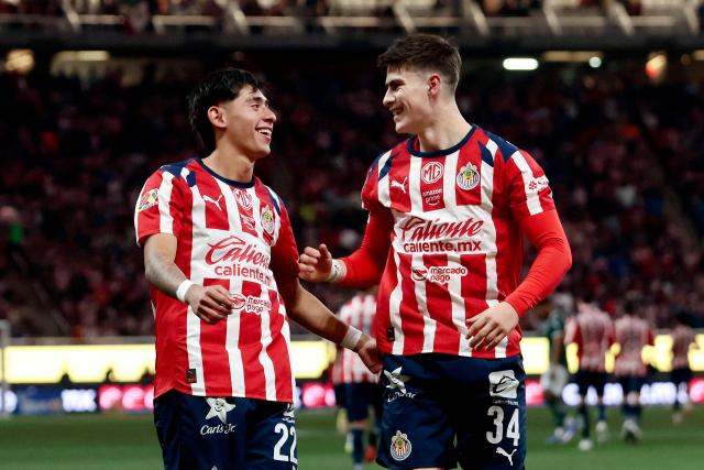 Guadalajara's forward #34 Armando Gonzalez (R) celebrates with teammate midfielder #226 Santiago Sandoval after scoring his team's third goal during the Liga MX Clausura football match between Guadalajara and Leon at the Akron Stadium in Guadalajara, Mexico, on March 18, 2026. (Photo by Ulises Ruiz / AFP)