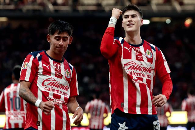 Guadalajara's forward #34 Armando Gonzalez (R) celebrates with teammate midfielder #226 Santiago Sandoval after scoring his team's third goal during the Liga MX Clausura football match between Guadalajara and Leon at the Akron Stadium in Guadalajara, Mexico, on March 18, 2026. (Photo by Ulises Ruiz / AFP)