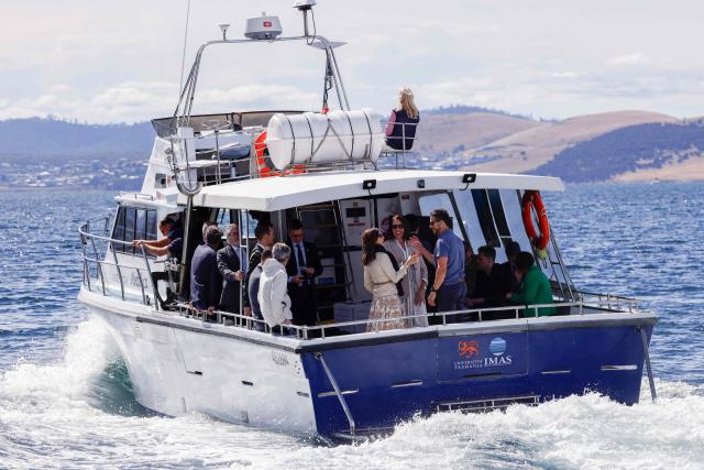 Denmark's King Frederik X and Queen Mary take a trip onboard an Institute for Marine and Antarctic Studies (IMAS) vessel to view the kelp conservation forest at the Alum Cliffs Marine Reserve in Hobart on March 19, 2026. (Photo by ROB BLAKERS / POOL / AFP)