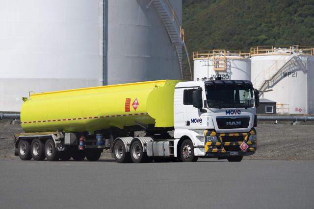 A fuel truck waits to be filled at the Seaview Fuel Storage centre in Wellington on March 19, 2026. In New Zealand, which is heavily dependent on imports for its fuel, the average petrol price has increased by nearly 10 percent since the Middle East war began, with diesel up more than 20 percent, according to price monitor Gaspy. (Photo by Marty MELVILLE / AFP)
