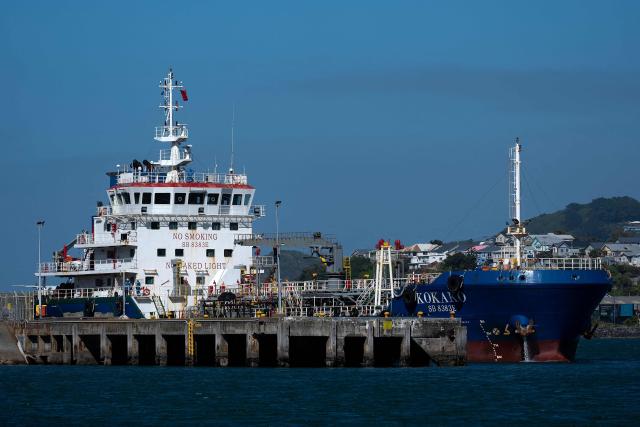 Bunkering tanker Kokako is moored at Burnham Wharf in Wellington Harbour with a load of Diesel and Bio-Diesel on March 19, 2026. In New Zealand, which is heavily dependent on imports for its fuel, the average petrol price has increased by nearly 10 percent since the Middle East war began, with diesel up more than 20 percent, according to price monitor Gaspy. (Photo by Marty MELVILLE / AFP)
