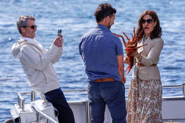 Denmark's King Frederik X and Queen Mary inspect a lobster during a trip onboard an Institute for Marine and Antarctic Studies (IMAS) vessel to view the kelp conservation forest at the Alum Cliffs Marine Reserve in Hobart on March 19, 2026. (Photo by ROB BLAKERS / POOL / AFP)