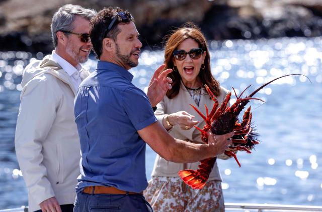 Denmark's King Frederik X and Queen Mary inspect a lobster during a trip onboard an Institute for Marine and Antarctic Studies (IMAS) vessel to view the kelp conservation forest at the Alum Cliffs Marine Reserve in Hobart on March 19, 2026. (Photo by ROB BLAKERS / POOL / AFP)
