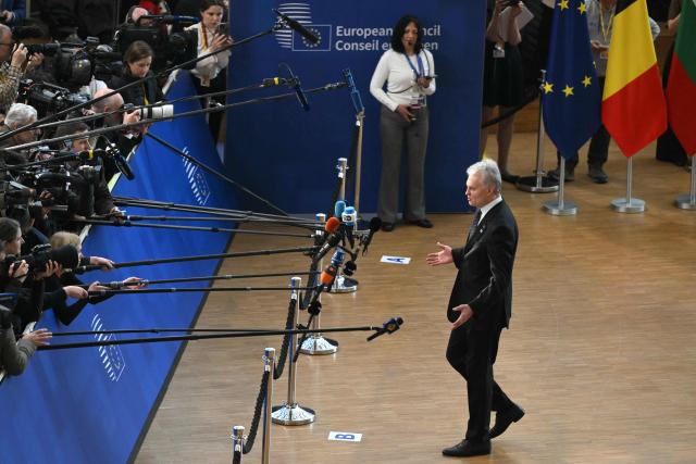 Lithuania's President Gitanas Nauseda speaks to journalists as he arrives for a EU Summit at the EU headquarters in Brussels, on March 19, 2026. European Union leaders meet in the context of the US-Israeli war against Iran that is consuming the Middle East, and its consequences on energy prices and security. (Photo by NICOLAS TUCAT / AFP)