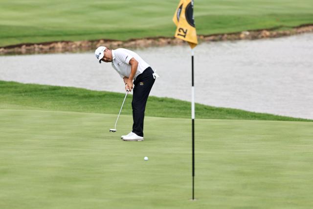 Wild Card Canadian player Richard T. Lee putts on the 12th green on the first day of the LIV Golf South Africa tournament at The Club in Steyn City on March 19, 2026. (Photo by PHILL MAGAKOE / AFP)