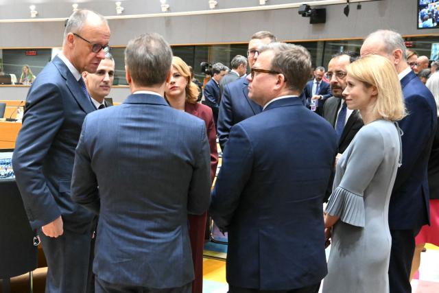 Germany's Chancellor Friedrich Merz (L) speaks with (from L) Bulgaria Caretaker Prime Minister Andrey Gurov, Latvia's Prime Minister Evika Silina, Estonia's Prime Minister Kristen Michal, Finland's Prime Minister Petteri Orpo, Cyprus' President Nikos Christodoulides and EU High Representative and Vice-President for Foreign Affairs and Security Policy Kaja Kallas ahead of rountable during the EU Summit at the EU headquarters in Brussels, on March 19, 2026. European Union leaders meet in the context of the US-Israeli war against Iran that is consuming the Middle East, and its consequences on energy prices and security. (Photo by NICOLAS TUCAT / AFP)