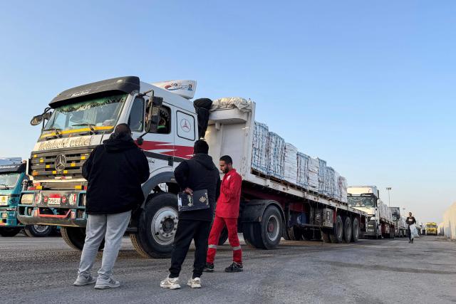 Trucks transporting humanitarian aid wait to enter through the Egyptian side of the Rafah border crossing with the Gaza Strip on March 19, 2026. Gaza's border crossing with Egypt reopened on March 19 for a limited number of people, Palestinian and Egyptian officials told AFP, for the first time since Israel and the United States launched strikes on Iran. (Photo by Amr ADEL / AFP)