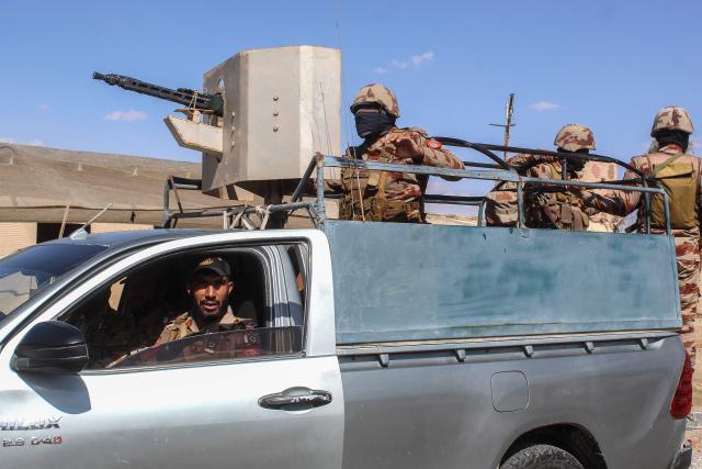 Pakistani soldiers patrol at the Pakistan-Afghanistan border in Chaman, Balochistan province on March 19, 2026. Pakistan and Afghanistan on March 18 announced a halt in fighting during celebrations for the end of Ramadan, after the deadliest strike in their escalating conflict killed hundreds in Kabul earlier this week. (Photo by Abdul BASIT / AFP)