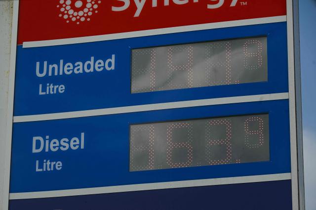 A sign showing prices at a petrol service station is pictured in Huddersfield, northern England on March 19, 2026. Britain's energy minister warned petrol retailers on March 13 that the government would not tolerate "unfair practices" amid a row over rising fuel prices sparked by the Middle East war. European gas prices soared as much as 35 percent on March 19 as fresh strikes hit energy infrastructure in the Middle East, including Qatar's main gas facility. (Photo by Oli SCARFF / AFP)