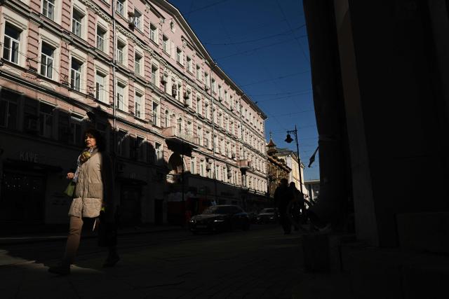 A woman walks along Myasnitskaya street in central Moscow on March 19, 2026. (Photo by Igor IVANKO / AFP)