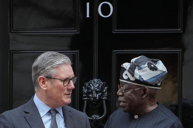 Britain's Prime Minister Keir Starmer (L) greets Nigeria's President Bola Tinubu on the steps of 10 Downing Street in central London on March 19, 2026, ahead of their meeting on the second day of a two-day state visit to the United Kingdom by Nigeria's president. (Photo by Kin Cheung / POOL / AFP)