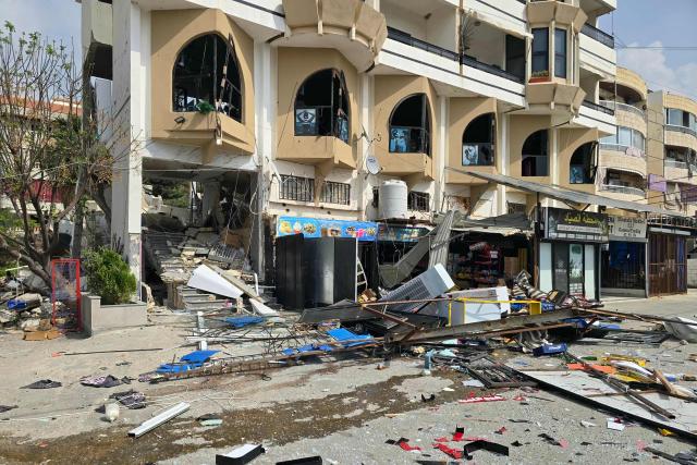 This photograph shows the destruction after an Israeli airstrike that targeted the southern coastal city of Tyre’s Al Hosh neighborhood, on March 19, 2026. Lebanon was drawn into the Middle East war on March 2 when militant group Hezbollah launched rockets towards Israel to avenge the killing of Iran's supreme leader Ayatollah Ali Khamenei. Israel responded with intense strikes on Lebanon that have killed at least 968 people and displaced over a million, according to local authorities, and by launching ground operations in the south. (Photo by KAWNAT HAJU / AFP)