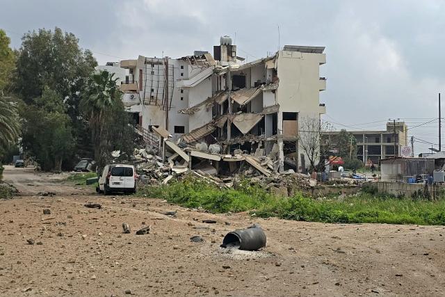 This photograph shows the destruction after an Israeli airstrike that targeted the southern coastal city of Tyre’s Al Hosh neighborhood, on March 19, 2026. Lebanon was drawn into the Middle East war on March 2 when militant group Hezbollah launched rockets towards Israel to avenge the killing of Iran's supreme leader Ayatollah Ali Khamenei. Israel responded with intense strikes on Lebanon that have killed at least 968 people and displaced over a million, according to local authorities, and by launching ground operations in the south. (Photo by KAWNAT HAJU / AFP)