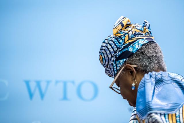World Trade Organization (WTO) Director-General Ngozi Okonjo-Iweala leaves after the launch of the global trade outlook at the WTO headquarters in Geneva on March 19, 2026. (Photo by Fabrice COFFRINI / AFP)