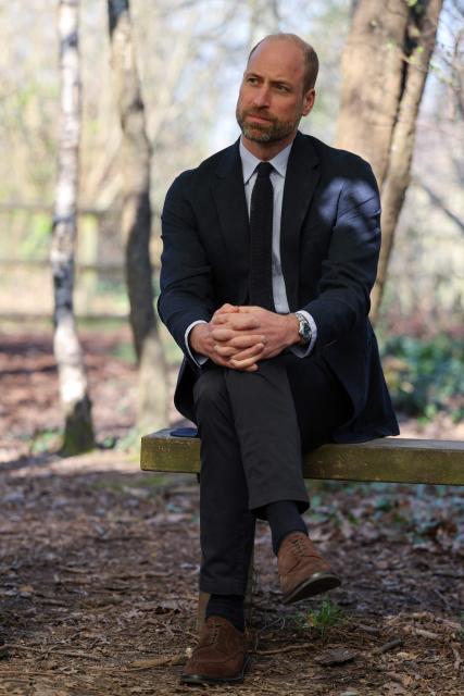 Britain's Prince William, Prince of Wales meets with students during a visit to the Bourne Academy, a co-educational state-funded secondary school and sixth form in Bournemouth, southern England on March 19, 2026, to hear about pioneering youth schemes, supported by the Homewards programme, which work to stop homelessness. (Photo by Adrian Dennis / POOL / AFP)