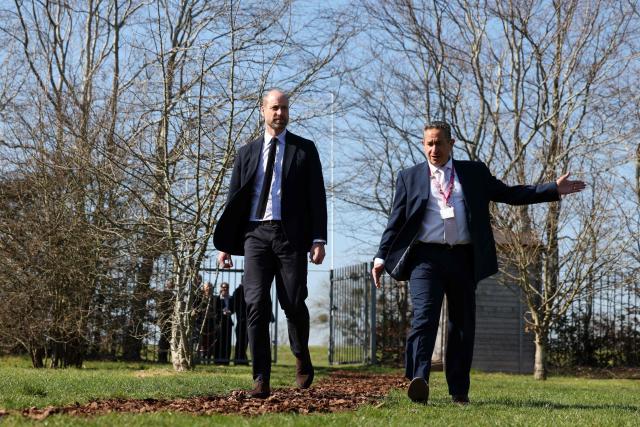 Britain's Prince William, Prince of Wales chats with principal Mark Avoth (R) during a visit to the Bourne Academy, a co-educational state-funded secondary school and sixth form in Bournemouth, southern England on March 19, 2026, to hear about pioneering youth schemes, supported by the Homewards programme, which work to stop homelessness. (Photo by Adrian Dennis / POOL / AFP)