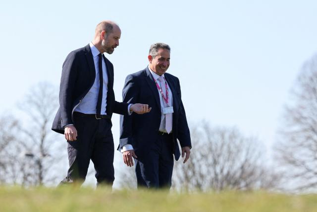 Britain's Prince William, Prince of Wales chats with principal Mark Avoth (R) during a visit to the Bourne Academy, a co-educational state-funded secondary school and sixth form in Bournemouth, southern England on March 19, 2026, to hear about pioneering youth schemes, supported by the Homewards programme, which work to stop homelessness. (Photo by Adrian Dennis / POOL / AFP)