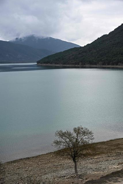 This photograph taken on March 19, 2026 shows a view of the Mediano reservoir amid high water level, in Mediano, Huesca province. This long-term project shows an inventory of several sites in Spain which are suffering from drought. Photos of the same places are taken every month over a very long period. (Photo by ANDER GILLENEA / AFP)