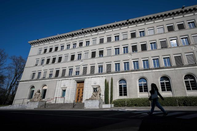 This photograph shows the headquarters of the World Trade Organization (WTO) after the launch of their global trade outlook in Geneva, on March 19, 2026. The Middle East war could weigh heavily on already slowing global trade, the WTO warned saying merchandise trade volume growth could be as low as 1.4 percent this year, compared to 4.6 percent in 2025. (Photo by Fabrice COFFRINI / AFP)